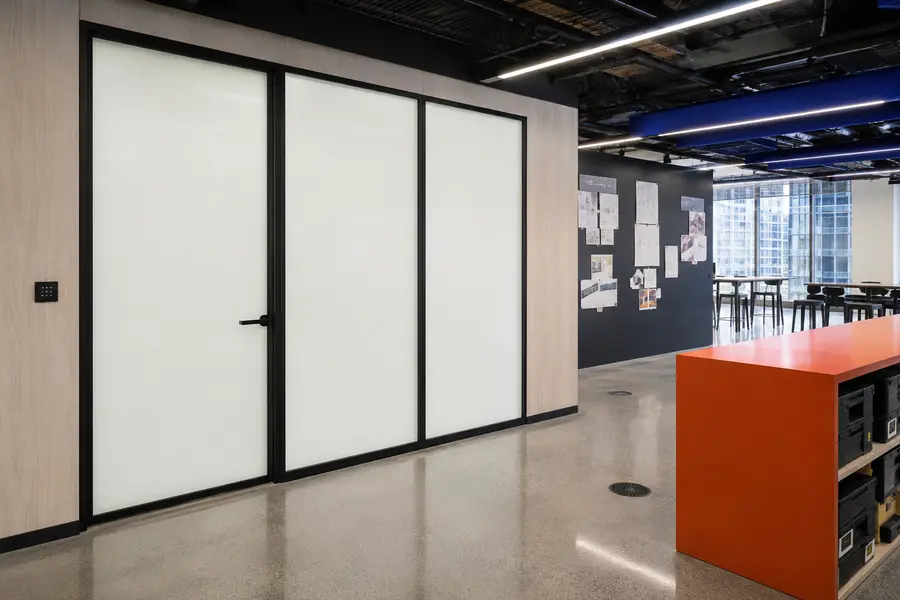 Clarity switchable privacy glass creating a private room in a corporate project workspace