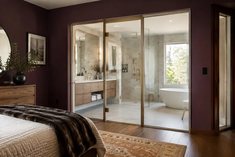 Clear-state Clarity switchable privacy glass between a bedroom and en-suite bathroom