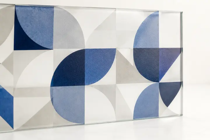 Blue geometric ceramic pattern digitally printed on clear architectural glass