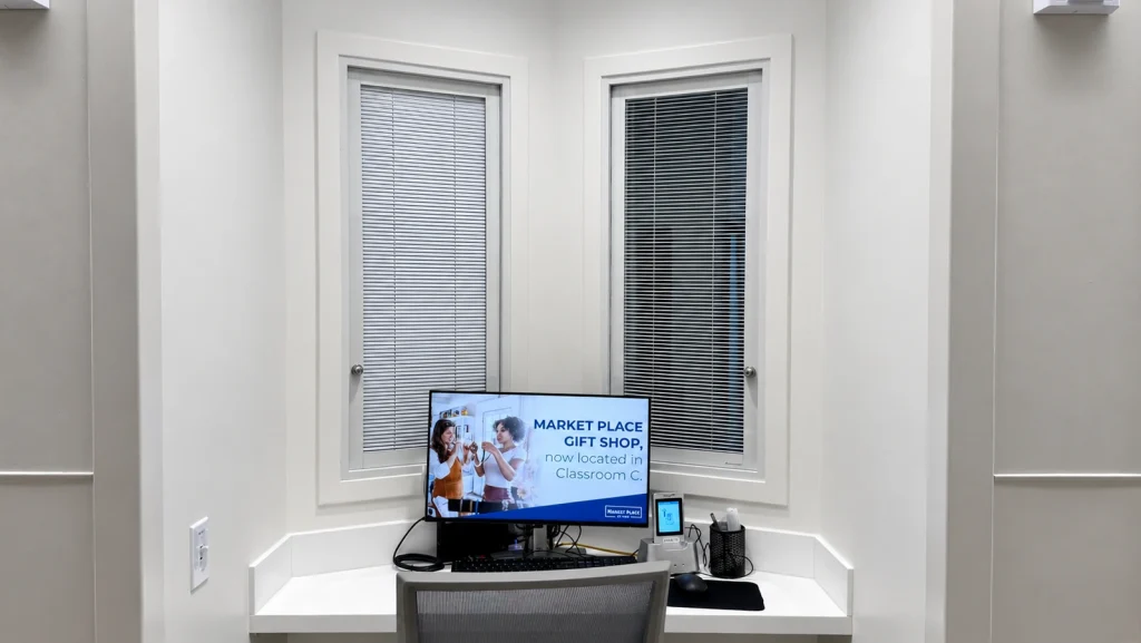Two interior windows with BetweenGlassBlinds at AdventHealth Daytona Beach, showing different blind positions.